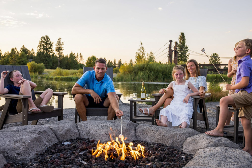 Relax | The outdoor deck and beach features both a fire pit and stone fireplace for après sunset activities (open seasonally) Relax | The outdoor deck and beach features both a fire pit and stone fireplace for après sunset activities (open seasonally)